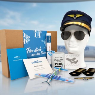 Geschenkbox für Flug und Pilot Erlebnisse mit Flugzeug im Hintergrund