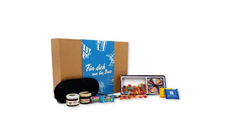 Geschenkbox der Erlebnisfabrik für Dinner in the Dark Erlebnisse mit passenden Inhalten und blauer Banderole.