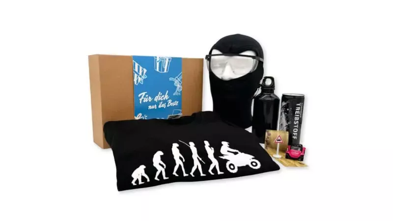 Geschenkbox der Erlebnisfabrik zu Quad Erlebnissen mit blauer Banderole.