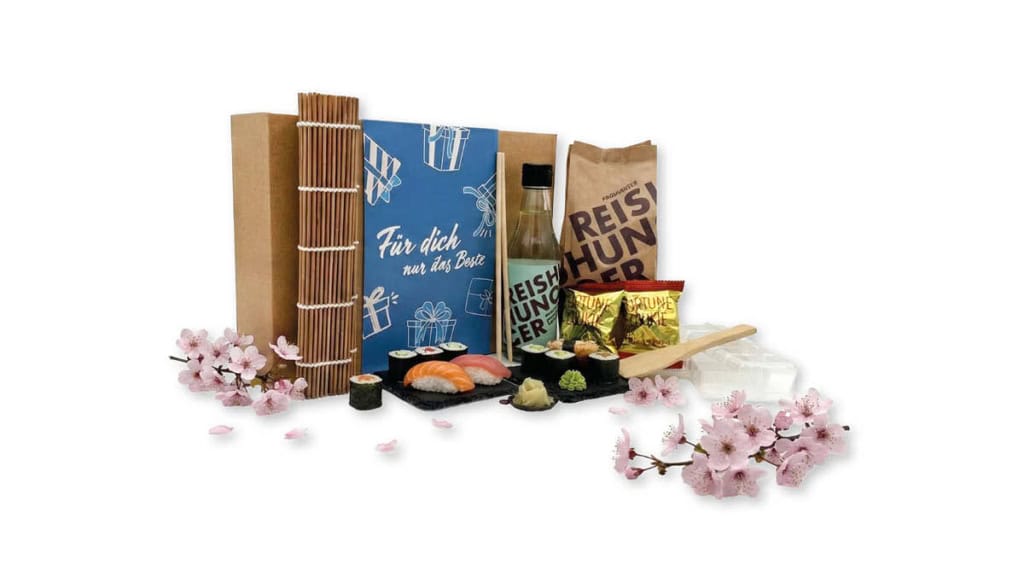 EF-Geschenkbox-Sushi Geschenkbox der Erlebnisfabrik zu Sushi Erlebnissen mit blauer Banderole.